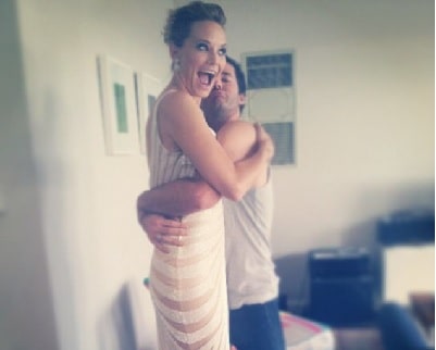 A picture of Adrienne Pickering hugging her boyfriend Chris Phillips.